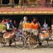Men on the street use their push bikes as market stalls to sell fresh fruit in Patan. On sale are apples, grapes, banans and oranges.