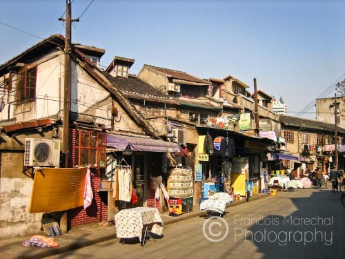 Shanghai is modernizing on a very fast pace and old housings are swept away to make room for newer ones. Such blocks of old constructions are becoming rarer in the city.